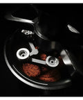 Top Shelf Espresso Needle Wdt Tool For 58mm Portafilter Black Coffee Ground Stirrer in action with coffee grounds.