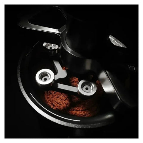 Top Shelf Espresso Needle Wdt Tool For 58mm Portafilter Black Coffee Ground Stirrer in action with coffee grounds.