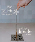 Hand holding Shower Drain Hair Catcher No Fuss Hair Trap For Easy Drain Maintenance Catches Long Hair Before It Bogs Your Pipes Prevents Clogs In Shower Drains Quick Install As Seen On Shark Tank White Flower 12 Pack over drain