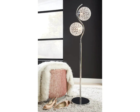 Winter Contemporary 59 Inch Floor Lamp With Acrylic Bead And Metal Shade In Silver next to chair in living room