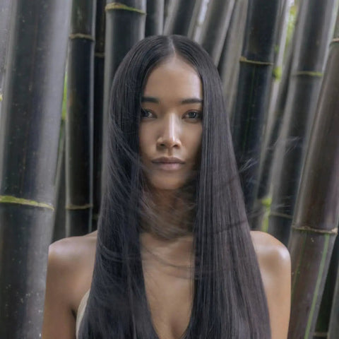 Person with long, straight hair in bamboo forest, Go-To Detangling Cream Rinse For Dry Damaged Color Treated Hair With Awapuhi And KeraTriplex, Strengthens And Repairs Each Strand, Color Safe Daily Conditioner, 2.5 Fl Oz