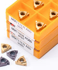 Front view of a 10-piece MMT 11ER AG60 US735 carbide inserts set with orange storage rack and loose triangular inserts