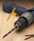 Heavy Duty Four Piece Drill Chuck Key Set For Electric Drill Press Plays Nice With 20mm 16mm 13mm And 10mm Chucks No Hassle Wrench next to a drill.