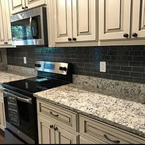 Gray White Black Granite Marble Look Vinyl Countertop Wrap Peel And Stick Waterproof Scratch And Heat Resistant Roll 36 By 120 Inches Removable Wallpaper installed on kitchen countertops and backsplash.