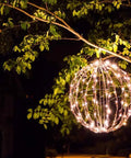 16 Inch LED Light Ball For Indoor And Outdoor Use With Warm White Lights Waterproof And Durable Lightweight Holiday Decor For Patio Or Wedding Displays Fold Flat Metal Frame For Easy Storage hanging from tree branch