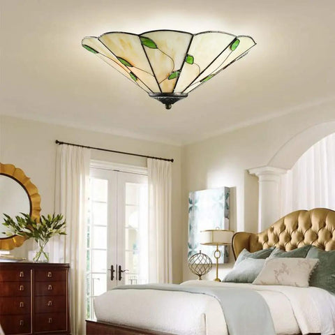 Cool Green Leaf Tiffany Style Flush Mount Ceiling Light With Stained Glass Shade For Living Room Corridor Bedroom And Restaurant 15 Inch Vintage Inspired Modern Ceiling Fixture LED CFL Incandescent Compatible E26 E27 Base, installed in elegant bedroom setting.