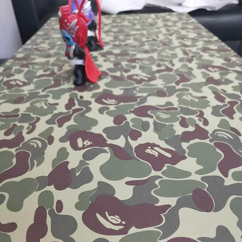 Table with green camouflage peel and stick vinyl contact paper for walls cabinets shelves dresser drawers and furniture decals