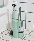 Green 4 In 1 Toilet Brush And Plunger Set with Angled Bowl Brush, Compact Scrubber, and Holder in bathroom setting