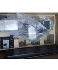 Front view of ZHRUI all-metal miniature lathe in foam packaging with a green adjustment knob