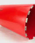 Side view of red 10-inch diamond core drill bit with segmented diamond edge for concrete.