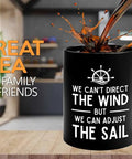 11 Oz Black Sailor Coffee Mug with nautical design "We Can Adjust The Sail" on kitchen counter