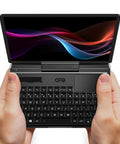 Badass 7 Inch FHD Touchscreen Mini Laptop PC Featuring Intel Core I3 N300 Eight Core Processor With 16GB RAM And 512GB SSD Drive Plus Fast WiFi 6 Hotspot For Daily Grind in hands with FHD display.