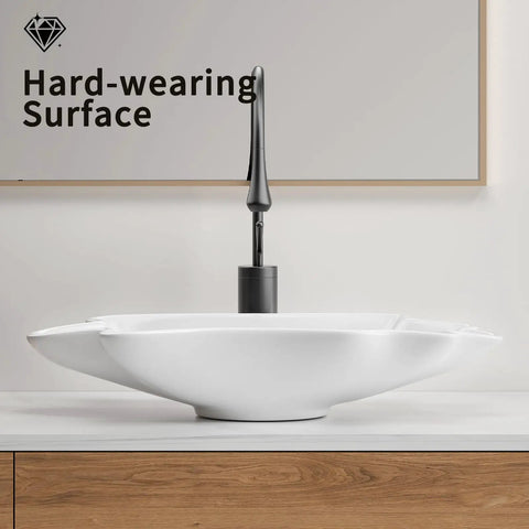 HAOCHRYSYPH Ceramic Shell Vessel Sink Bowl, Milk White, 24.41x13x4.73 in. view with modern faucet on wood counter.