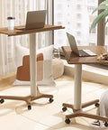 No Drama Roll Mobile Standing Desk Featuring Smooth Gas Lift Adjustments And A Tilt Tray Top Portable Laptop Desk with laptop and coffee cup.