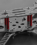 Close-up of F4 X1 175mm FPV Racing Drone Frame Kit Carbon Fiber Quad Frame Rack showing carbon layers and red supports.