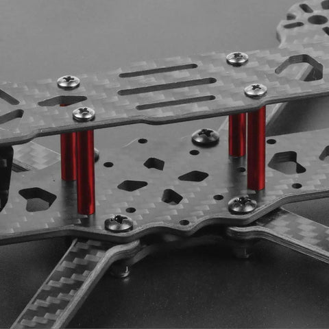 Close-up of F4 X1 175mm FPV Racing Drone Frame Kit Carbon Fiber Quad Frame Rack showing carbon layers and red supports.