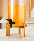 Heavy Duty Black Plastic Cooler Faucet And Reusable Spigot Tap With Leak Proof Seal For Water Buckets Party Coolers Beverage Dispenser mounted on a beverage dispenser.