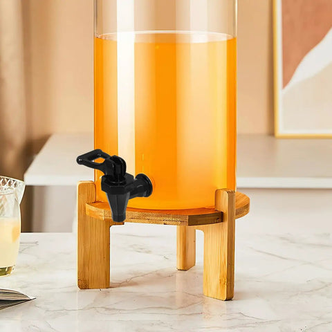 Heavy Duty Black Plastic Cooler Faucet And Reusable Spigot Tap With Leak Proof Seal For Water Buckets Party Coolers Beverage Dispenser mounted on a beverage dispenser.