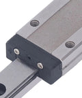 Close-up of Miniature Linear Guide Rail With Bearing Steel Carriage Block 100mm Motion Guide, showing carriage block and screws.