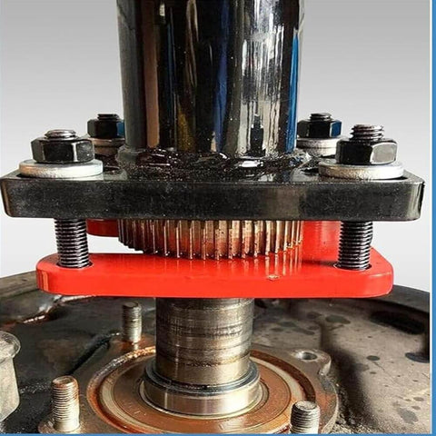 Pro Grade Rear Axle Bearing Puller And Installer Tool For ABS Tone Ring And Wheel Bearing Removal in use, close-up view.