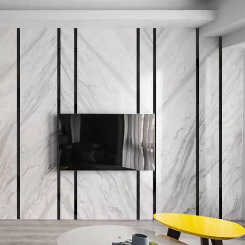 Living room with Slick Self Adhering Stainless Steel Black Metalized Wall Trim Molding With Mirror Like Finish around TV