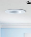 Samsion Smooth Reflector Trim Retrofit Kit, 6 Inch Dimmable LED Downlight mounted on a light blue ceiling.