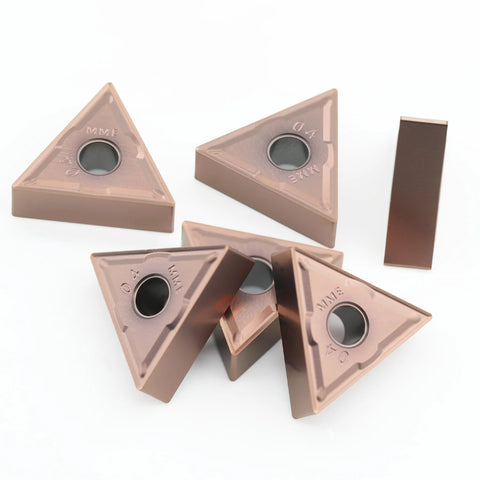 Top view of five brown triangular carbide turning inserts with center mounting hole for CNC lathes