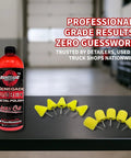 Front view of Renegade Pro Red Metal Polish bottle with yellow foam polishing cones on a workshop workbench.