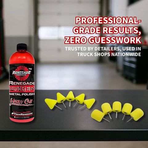 Front view of Renegade Pro Red Metal Polish bottle with yellow foam polishing cones on a workshop workbench.
