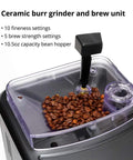 Black Espresso Machine With 54 Oz Tank And Ceramic Burr Grinder Delivering Barista Level Brews At Home showing ceramic burr grinder and bean hopper.