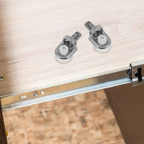 Top view of 24 Pack Zinc Alloy Shelf Support Pegs For Cabinets And Cupboards on wooden shelf, metal construction visible.