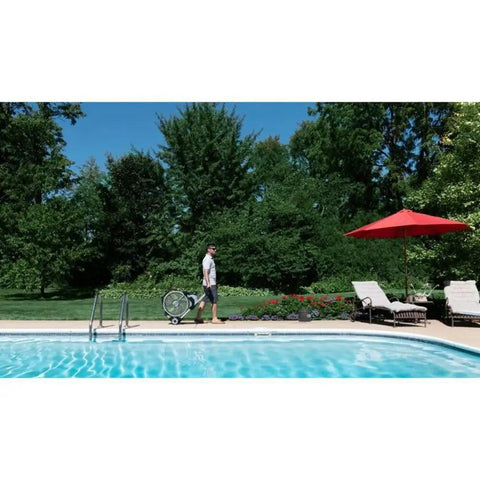 Man using Go To Outdoor Mist Cooling Fan With 18 Inch Blade, 5 Speed Settings by poolside