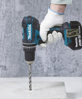 Eighteen Volt Combo Drill Featuring Rock Solid Keyless Chuck Dual Gear Motor Up To Sixty Two Newton Meters Torque in use on concrete