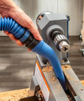 Flexible Click Connect Crevice Vacuum Attachment For Deep Cleaning In Tight Spaces Slim Extra Long Reach Non Marring Design Great For Woodworking Projects And General Vacuum Cleaning Tasks being used on woodworking equipment.