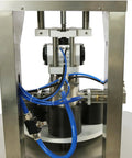 Heavy Duty Vacuum Capper For Glass Jars And Tin Cans With Adjustable 30 To 80 Mm Jaw, stainless steel machine with blue hoses.