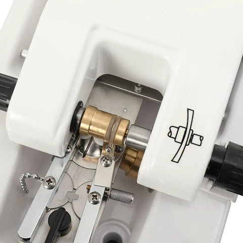 Close-up of Tough As Nails Automatic Optical Lens Groover components, showcasing precision parts and rust-resistant panel details.