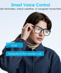 Person using All Day Comfy Smart Glasses With Built In Mic And Speakers Blue Light Blocking Lenses Wireless Headphones For Office And Travel Voice Control Unisex Design For Men And Women Easing Eye Strain And Sleep Support, interacting via voice command.