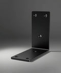 Black metal L bracket, part of 8 Pack Heavy Duty 4x4 Inch 90 Degree Metal Corner Brackets For Shelves And Cabinets, shown on gray background.