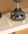 Top Shelf High Speed Steel Forstner Bit Set With Adjustable Depth Stop Collar drilling into wood with shavings around.