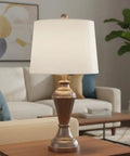 White Linen Empire Lamp Shade With Brass Spider Fitter Transitional Style 14 Inch Top 16 Inch Bottom 12 Inch Slant Height Harp Attachment Ready For Harp Lamps on a table in a living room