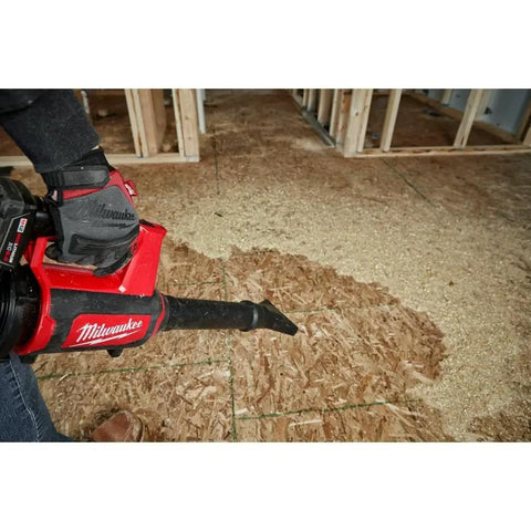 12V Cordless Compact Spot Blower Tool Only Chrome Finish For Quick Debris Cleanup in action on wooden floor, battery not included