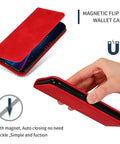 Red magnetic flip wallet case with auto-closing, showing phone inserted and hand holding case
