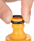 Close-up of a hand fitting black O-rings on a quick-connect fitting from Three Quarter Inch Garden Hose Washers And O Rings Set Pro Grade.