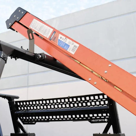 Built Tough 23.5 Inch Powder Coated Aluminum Ladder Roller With T Slot Compatibility For Roof Racks And Pickup Trucks providing stability for loading a ladder.
