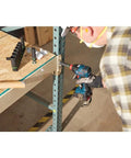 Person using 18V All In One Impact Driver And Wrench Kit With One Quarter Inch Hex Shank And One Half Inch Square Drive on metal frame