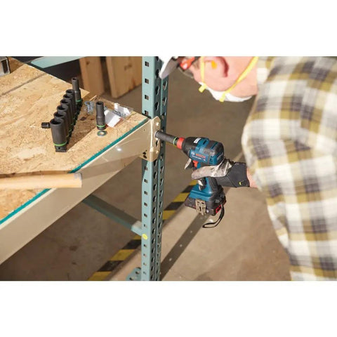 Person using 18V All In One Impact Driver And Wrench Kit With One Quarter Inch Hex Shank And One Half Inch Square Drive on metal frame