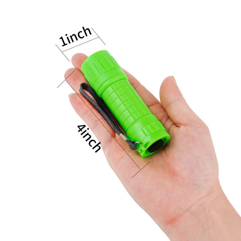 Green mini flashlight held in hand, shows 4-inch length and 1-inch width, 30 Pack Mini LED COB Flashlights Assorted Colors With Batteries Included Pocket Size EDC Light High CRI 90 Plus Soft Clear Illumination Five COB Bulbs 30 Lumens 5 Meter Range Perfect for Car Glove Box.