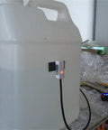 No Contact Liquid Level Sensor For Pipes And Tanks, Contactless Water Level Detection With NPN Output mounted on water container