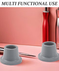 Grippy Anti Slip Rubber Feet For Shower Chairs And Tub Transfer Benches In Wet Bathrooms 4 Pack shown on pink surface