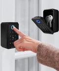 Person using Matrix Key Lock Box with wireless hub and Bluetooth access, showing keypad and open compartment with keys for outdoor use.